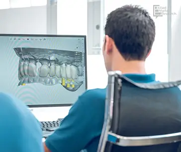 Doctor reviewing dental X Ray on monitors